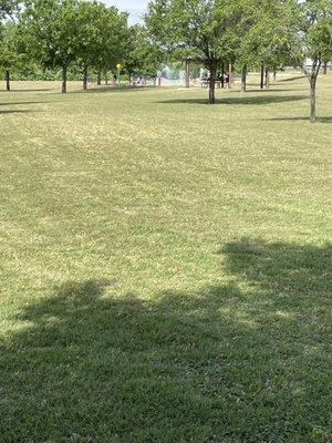 Long distance shot of the water feature. The main attraction at the park. That and the big field nearby for sports.