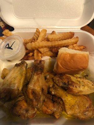 Lemon pepper chicken wings and fries