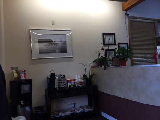 Beverage area with coffee, tea, and water.