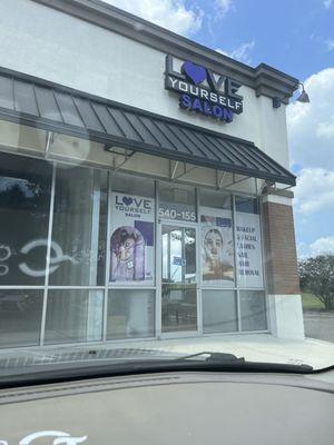 Entrance to the Salon and photo of nail polish selections