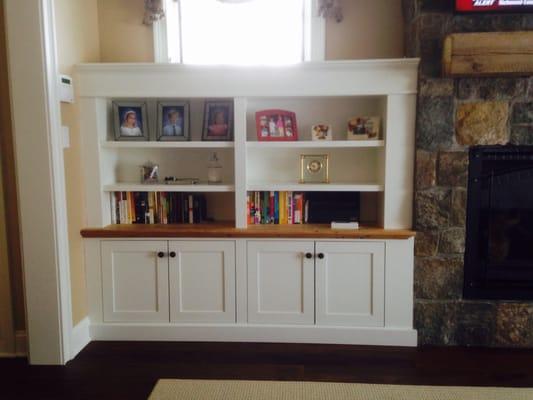 Paint grade cabinetry with clear maple interiors and reclaimed lumber counters