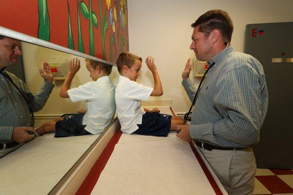 Dr. Rice and his patient high-fiving