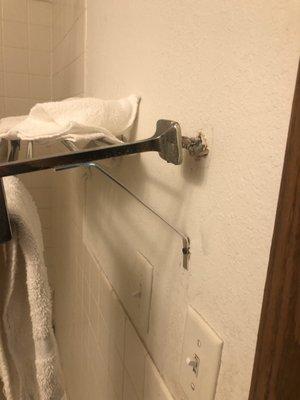 The towel rack had undergone numerous failed repairs.