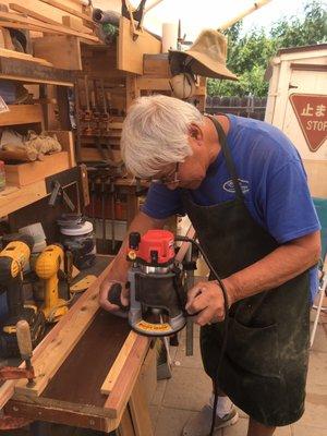 Dad hard at work, but enjoying every minute working with wood.