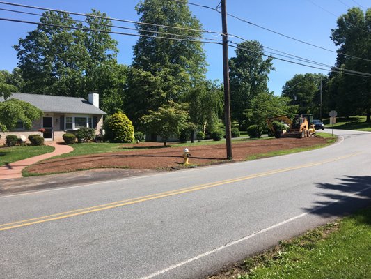 create berm in front yard to control water runoff from street