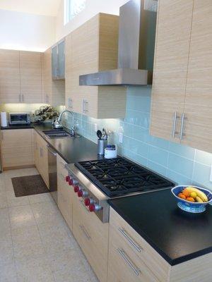 Natural blonde bamboo in a setting reflective of this kitchen's ocean view.