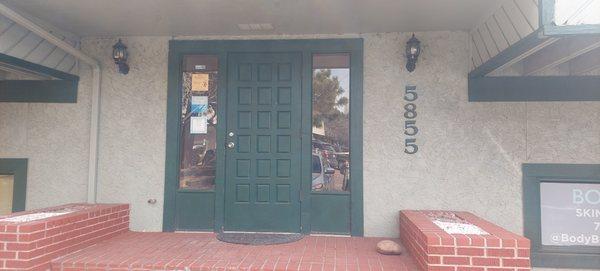 Front door entrance to the spa. Upon entering Honeybee Massage is down the stairs to the left.