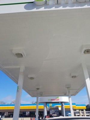 after - coated the gas station canopy deck with a special formulated product to protect and improve appearance.