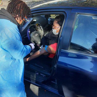 Patient getting labs drawn in the car.