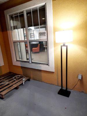 Outside front entry: Floor lamp and wood pallet