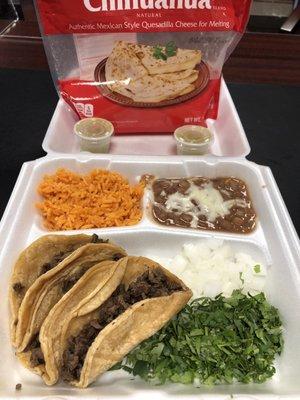 Steak tacos, rice and beans.