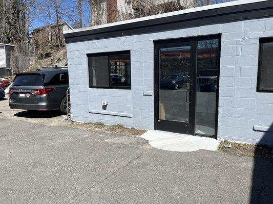 The entrance to the office, located on the left of building.