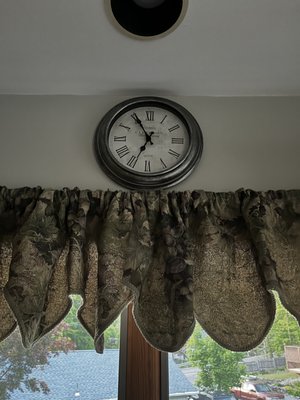 Took this photo of clock with darkening sky in background. Previous owners did not adjust clock. It's five minutes to eight, not seven.