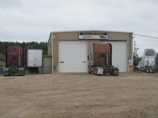 One 14' drive through bay with service pit, and one 14" drive in bay.