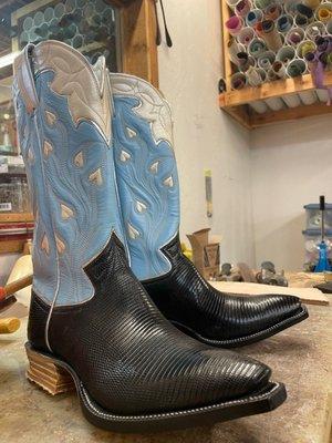 A beautiful pair of bespoke cowboy boots in the studio being made by bespoke cowboy boot maker Flora Knight.