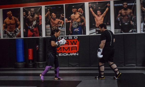 Coach ray longo training one of our kickboxing champions Jennie Nedell.