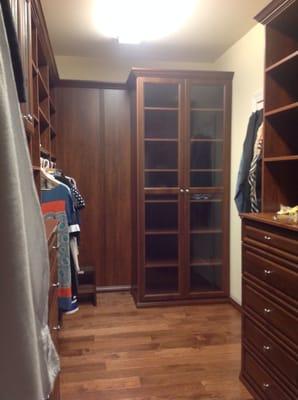 Queen City closets master closet in Lewis cherry wood grain