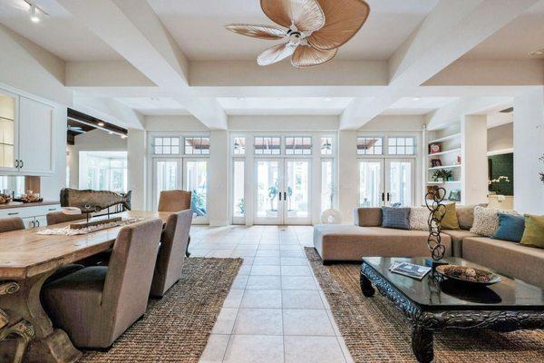 Living and Dining Areas in a Waterfront Home on Anna Maria Island. Professionally Staged by Doshia Wagner of NonStop Staging.