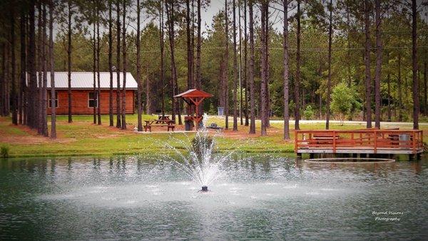 A view of our beautiful pond that offers fishing and relaxation.