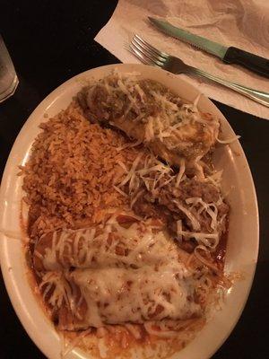 Two enchiladas with a wet burrito and sides of refried beans and mexican rice