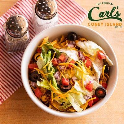 Carl's Taco Salad : Fritos, Nachos or Doritos topped with Carl's Famous Chili, Shredded Cheese, Lettuce, Tomato, Black Olives and Onions