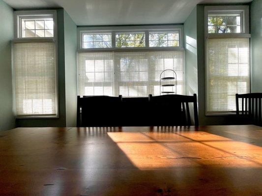 Dining room woven wood shades.