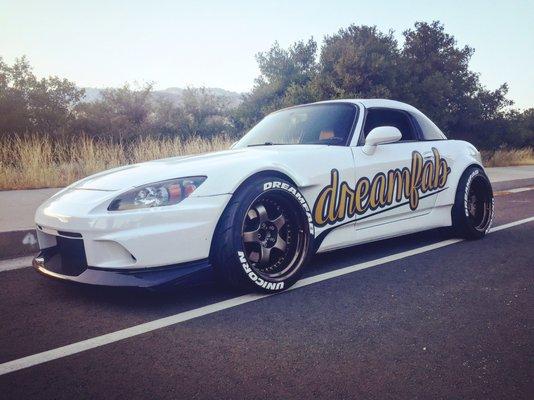 Custom extended front bumper, two tone painted hardtop.