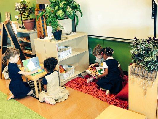 Children's House students enjoy books.