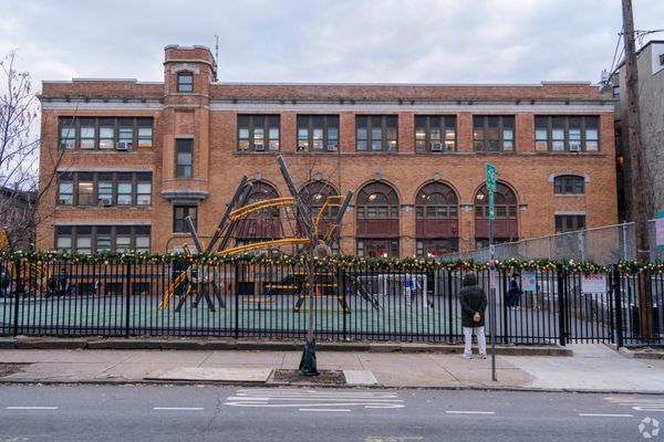 The main building at 96 Sussex Street for 2nd through 5th grade with the public park used as a recess area in the foreground