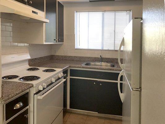 Kitchen with window and granite counter top