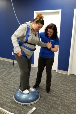 Bosu balance exercise in Safety Overhead System harness