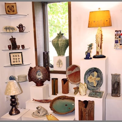 Handbuilding Show  in Gallery/Shop featuring lamps, platters and other crafted items for the home.