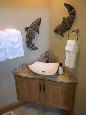 Beach house fun powder room.  Alder cabinet with a clear finish.