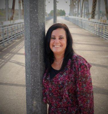 Michelle Hackett standing on old bridge on 59