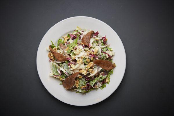 Baby arugula, radicchio, endives, roasted spicy walnuts, roasted pears with homemade Gorgonzola dressing.