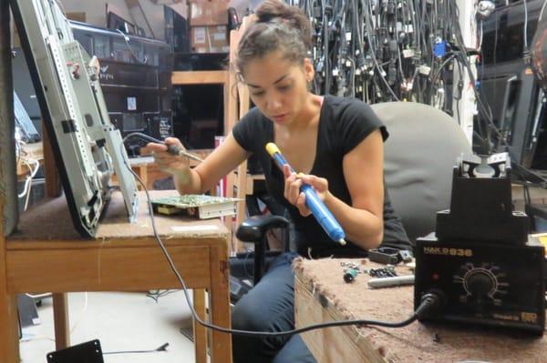 Sandra working on a Vizio power supply.