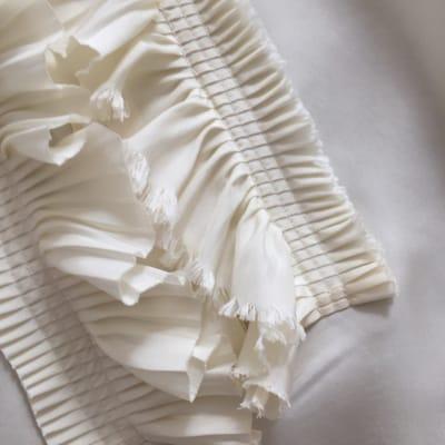 Frayed frill on silk blouse