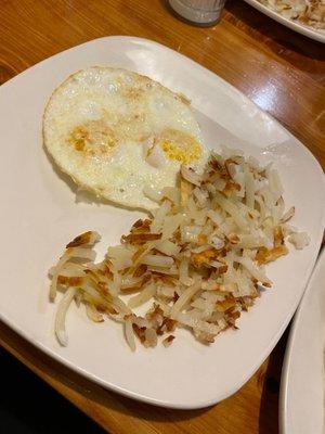 Hash-browns with eggs over easy.