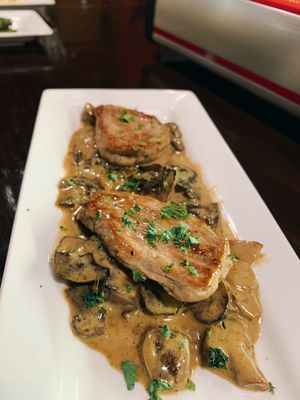 Pork Tenderloins over a creamy porcini mushroom sauce