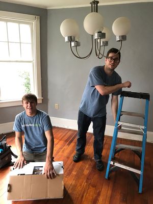 Tristian & Dave hanging a new Dining Room Chandelier.