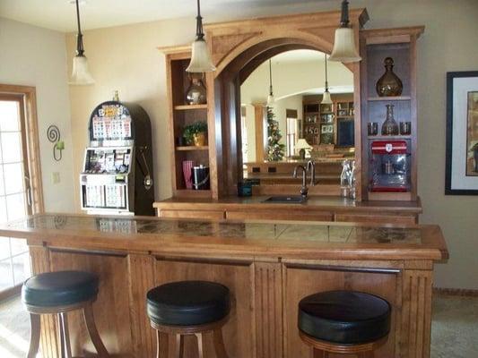 Bar cabinets made of birch with tiled tops.