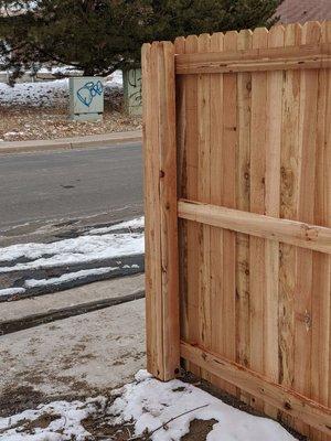 This is a picket wrapped finished corner tie in. It compliments the leveling and the over all aesthetics of the fence.