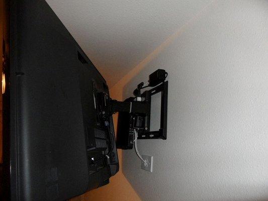 Santa Anna CA DirecTV mounted behind TV in old home with wiring concealed