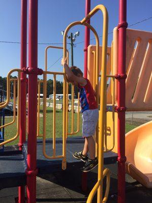 Playground area for kids next to standa