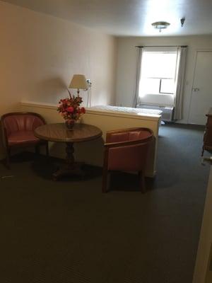 This room has a sleeping area and a Tv area. Room also has its own heating and air conditioning unit, two closets and a restroom