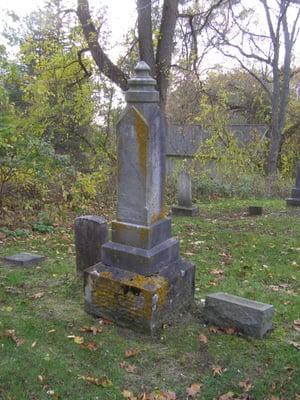 Personal pic- a moss covered memorial headstone.