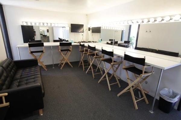 Brightly lit Dressing Room seats six people for hair and make-up.