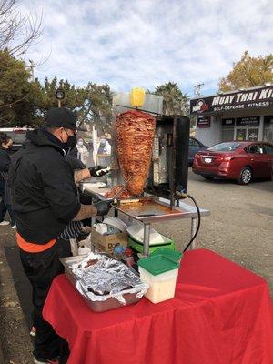 Chef cooking Al Pastor meat and pineapple