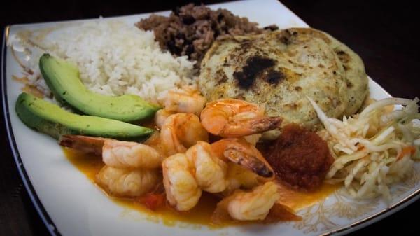 Pupusas with pickled slaw(curtido), shrimp in tomato sauce, avocado and rice. Delicious.