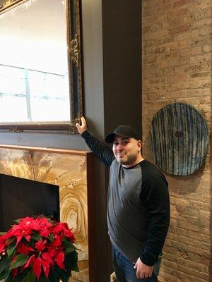 That's Malcolm with the gigantic mirror over his right shoulder and the heavy tile piece over his left. Great work installing both!